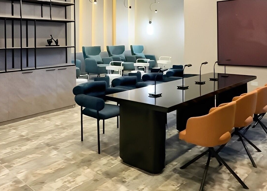 Modern interior of Aiona - The Art of Nails in Lagos, Lagos, NG with stylish seating and sleek tables.