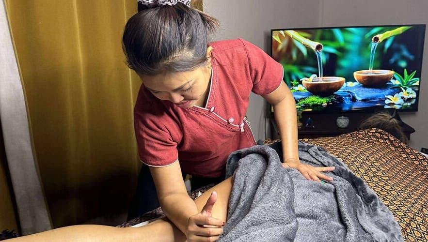 Therapist at Original Thai Massage in Brighton by Pear, Brighton, GB, delivers a soothing massage.