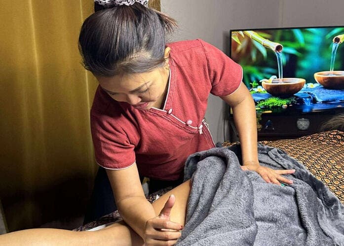 Therapist at Original Thai Massage in Brighton by Pear, Brighton, GB, delivers a soothing massage.