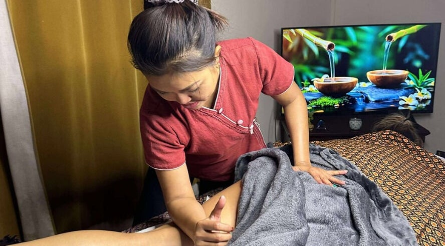 Therapist at Original Thai Massage in Brighton by Pear, Brighton, GB, delivers a soothing massage.