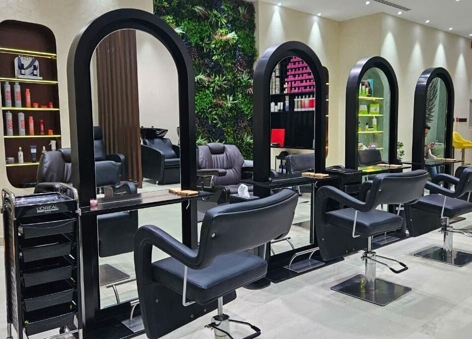 Modern salon interior at Gaia Beauty Lounge in Dubai, Dubai, AE featuring sleek styling chairs and mirrors.