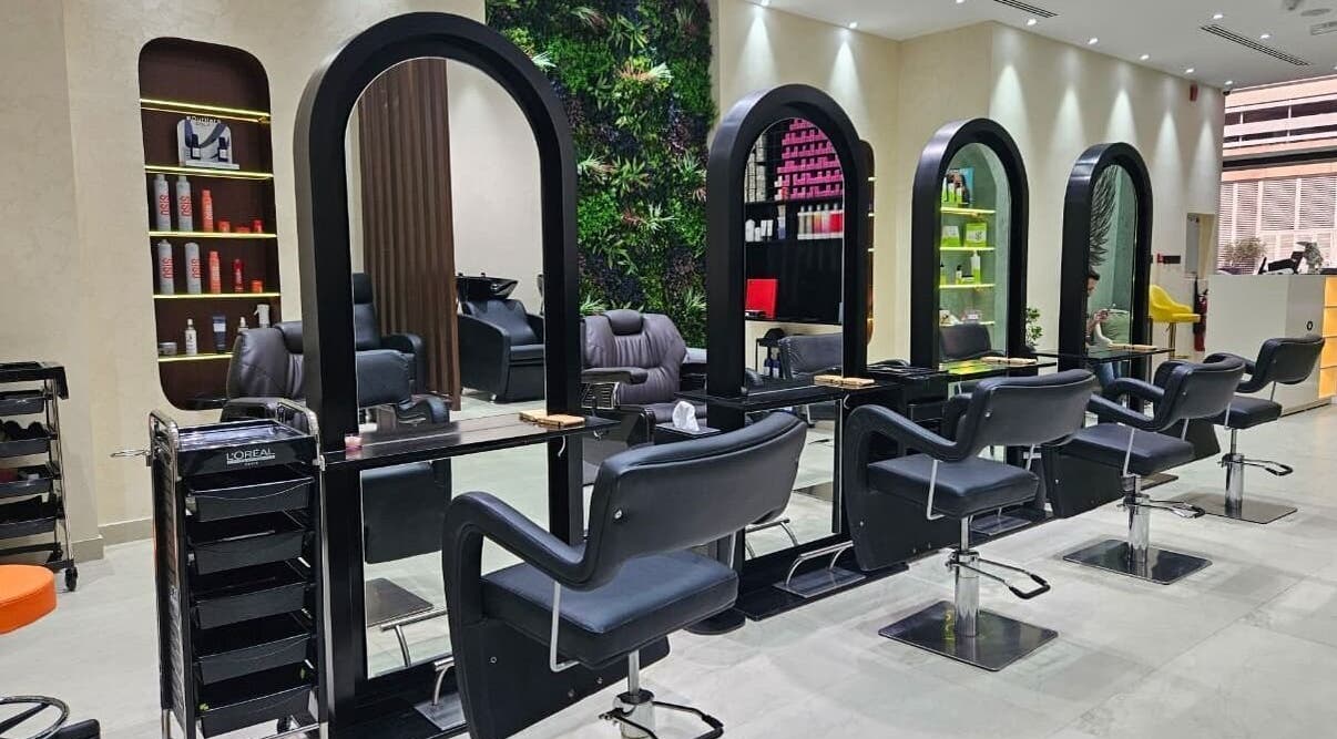 Modern salon interior at Gaia Beauty Lounge in Dubai, Dubai, AE featuring sleek styling chairs and mirrors.