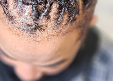 Detailed view of braided hairstyle at Sleeks Salon, Toronto, Ontario, CA showcasing artistry and style.