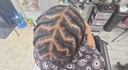 Intricate braided hairstyle at Sleeks Salon in Toronto, Ontario, CA. Experience expert styling and care.