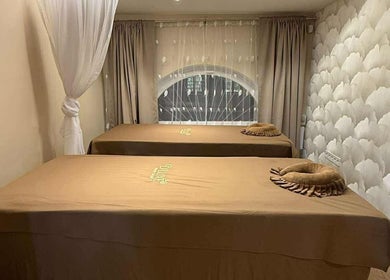 Tranquil massage room at D'luxe Beauty Salon, Budapest, Magyar, HU with treatment beds and soothing decor.
