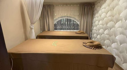 Tranquil massage room at D'luxe Beauty Salon, Budapest, Magyar, HU with treatment beds and soothing decor.