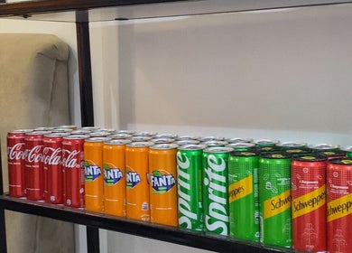 Beverage cans on display at Glamor Nails and Beauty, Ikeja, Lagos, NG, perfect for customer refreshment.