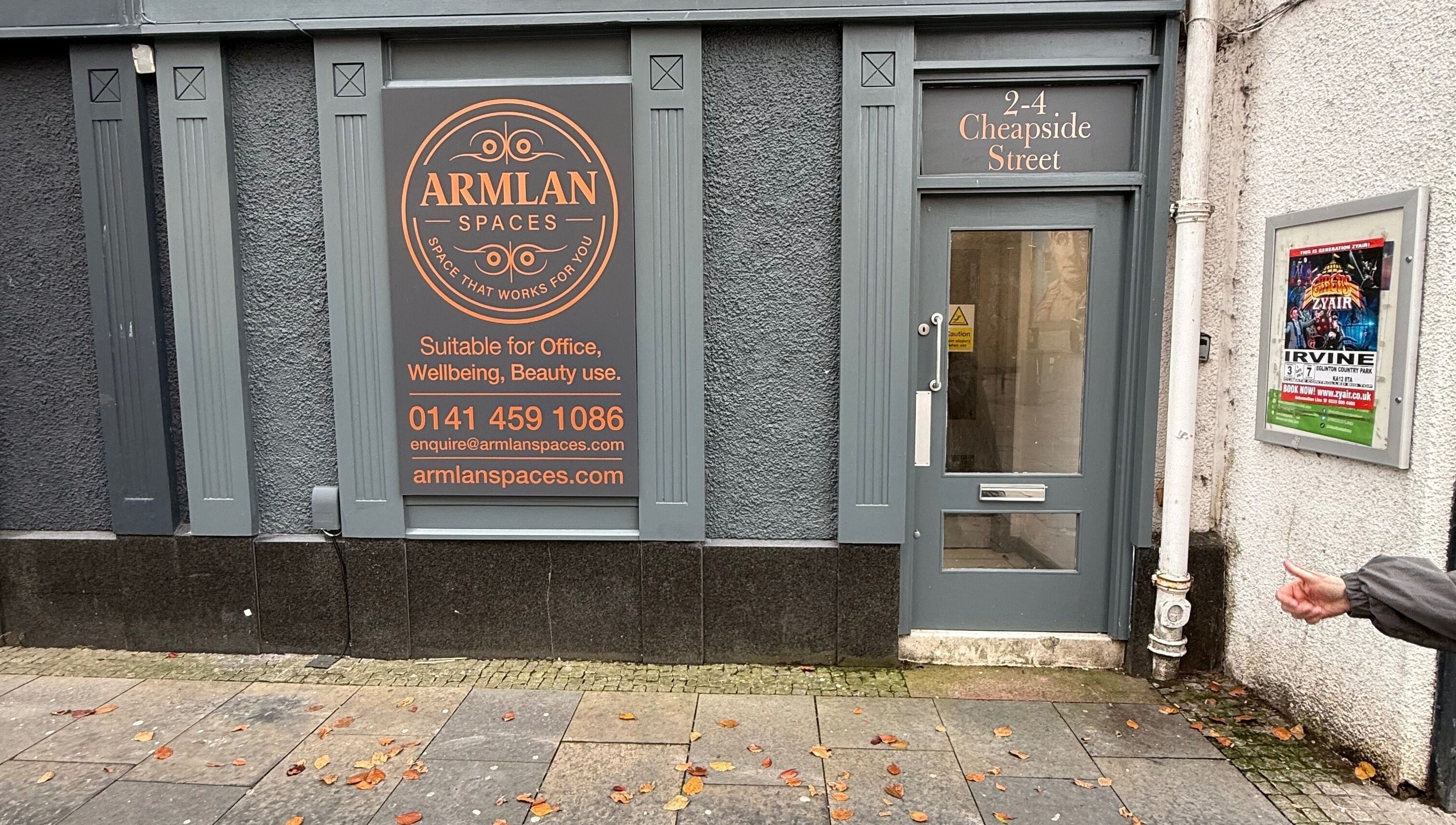 Front entrance of Twinz Trimz at Kilmarnock, Scotland, GB with signage for wellness and beauty services.