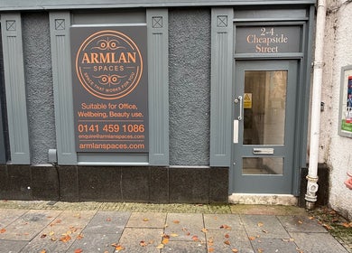 Front entrance of Twinz Trimz at Kilmarnock, Scotland, GB with signage for wellness and beauty services.