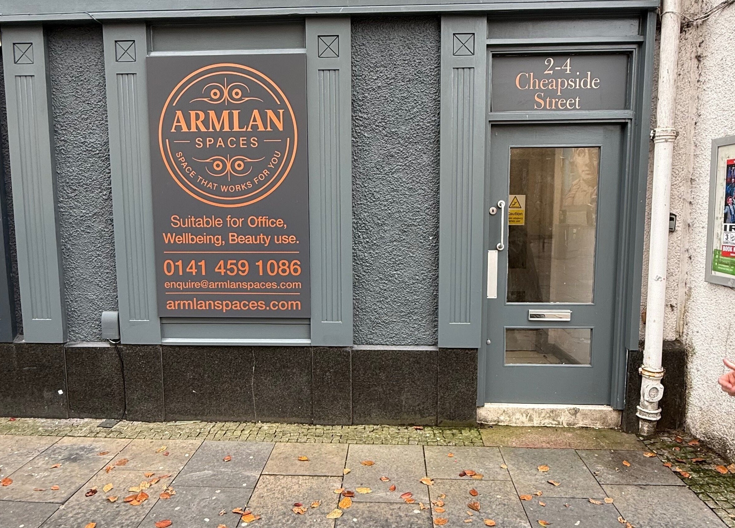 Front entrance of Twinz Trimz at Kilmarnock, Scotland, GB with signage for wellness and beauty services.