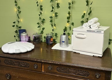 Calming spa setup with towel warmer at Sleepy Koi Bodyworks, Swartz Creek, Michigan, US.