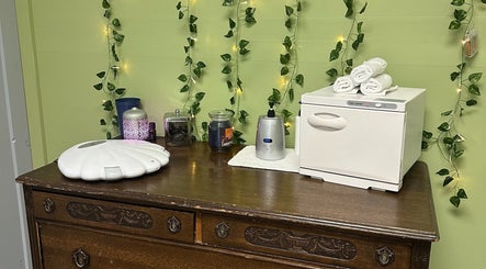Calming spa setup with towel warmer at Sleepy Koi Bodyworks, Swartz Creek, Michigan, US.