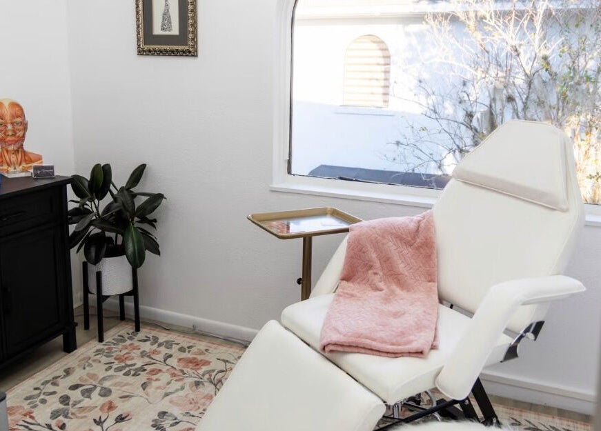 Serene beauty room at Amanda at Vanity Artistry, Winter Park, Florida, US, featuring a luxurious treatment chair and warm decor.