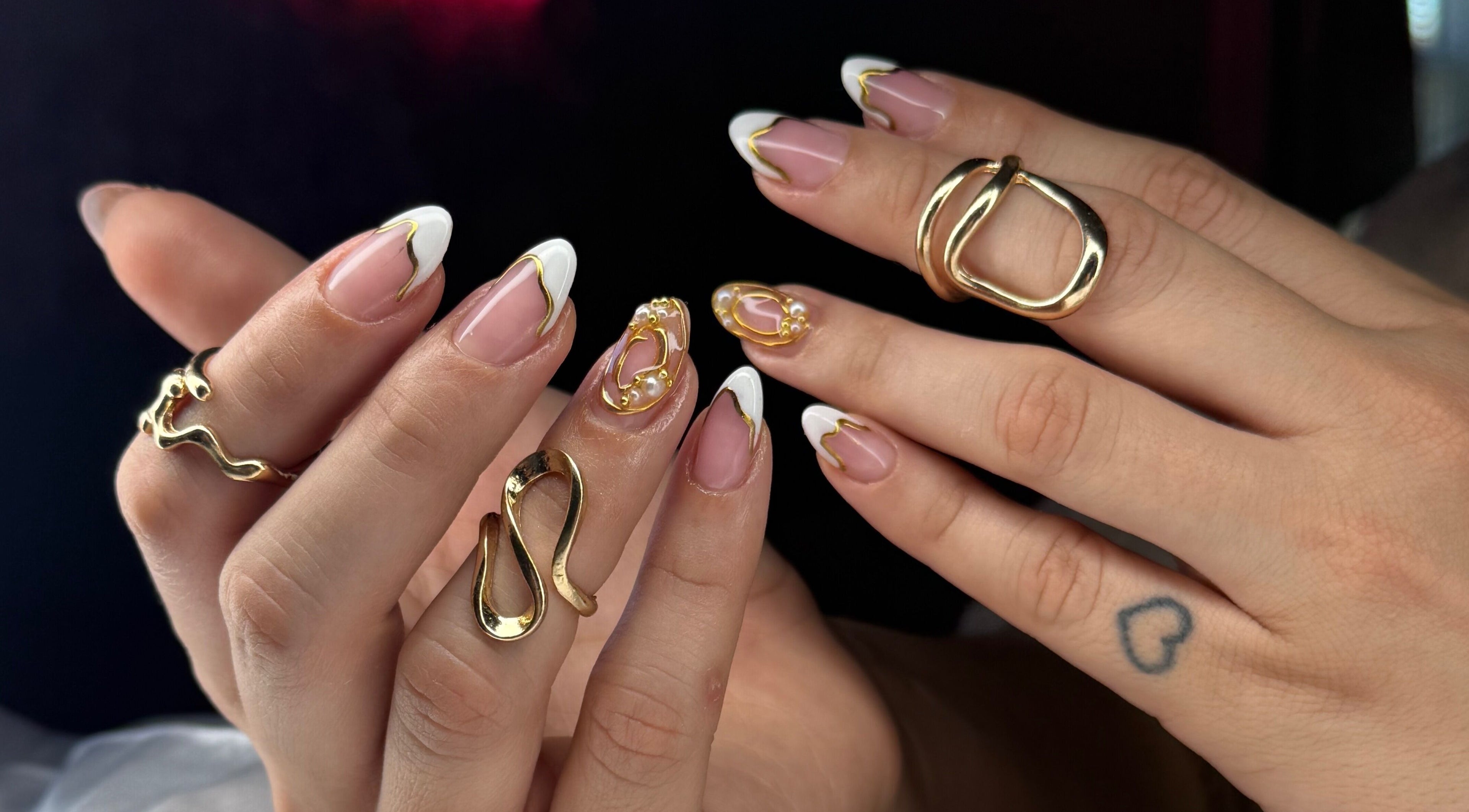 Elegant nail art with gold accents at Ailen Nails, Louisville, Kentucky, US.