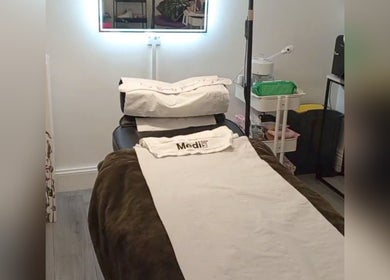 Relaxing treatment room at Little Beauty Secrets, Cowdenbeath, Scotland, GB featuring a cozy spa bed.