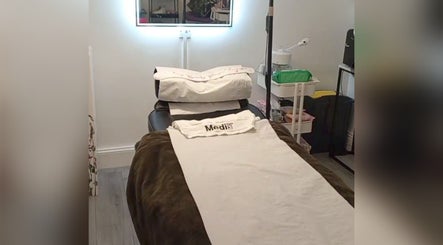 Relaxing treatment room at Little Beauty Secrets, Cowdenbeath, Scotland, GB featuring a cozy spa bed.