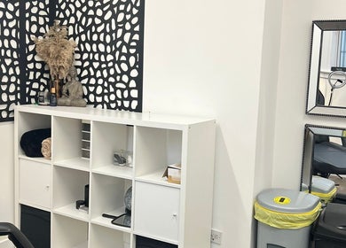 Cozy corner at Little Beauty Secrets, Cowdenbeath, Scotland, GB, featuring a shelf with decor and mirrors.