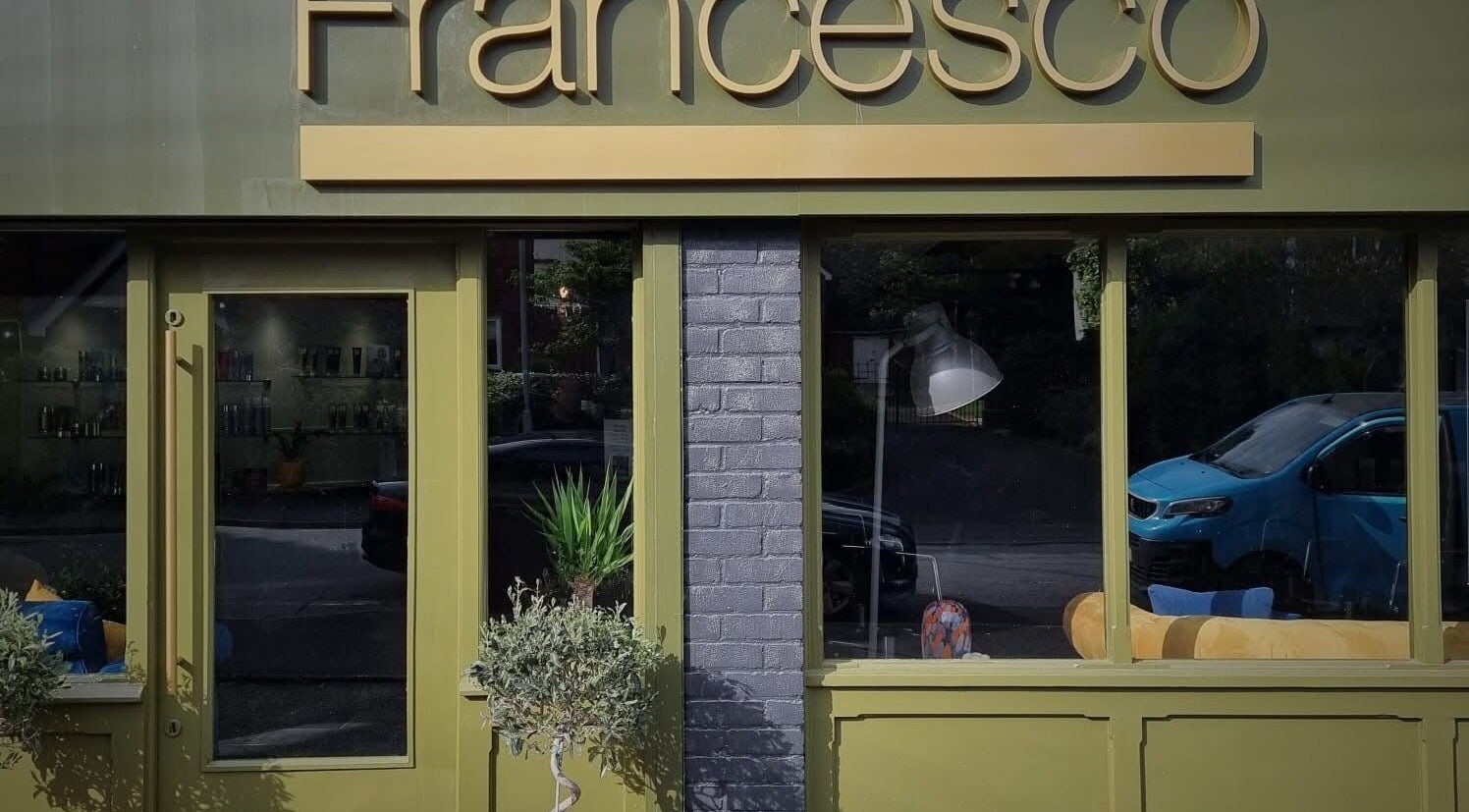 The Skin Studio in Sutton Coldfield, England, with a stylish green storefront and modern decor.