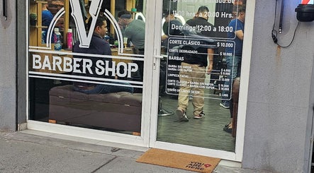 VEGASBARBERSHOP entrance in San Miguel, Región Metropolitana, CL, showing stylish interior and services.