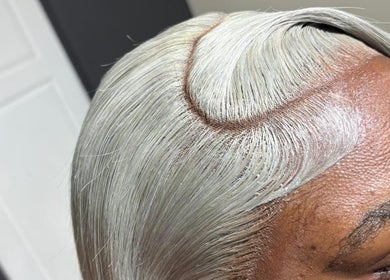 Close-up of a sleek silver hairstyle at Lace me Sav, Willemstad, Curaçao, CW.