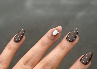 Brown nails with blue dots and an accent design at Nails by Gurleen, Delta, British Columbia, CA.