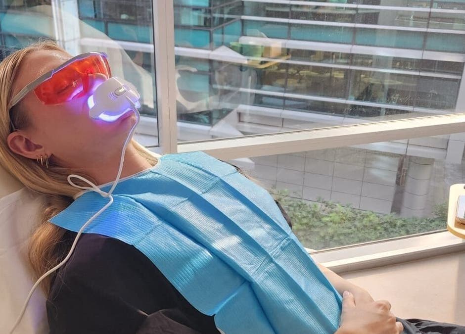 Teeth whitening session at Glow Body & Mind, North Sydney, New South Wales, AU with protective eyewear.