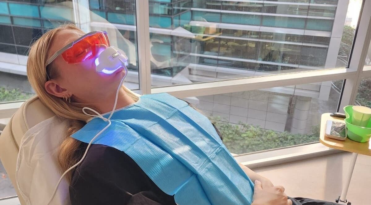 Teeth whitening session at Glow Body & Mind, North Sydney, New South Wales, AU with protective eyewear.