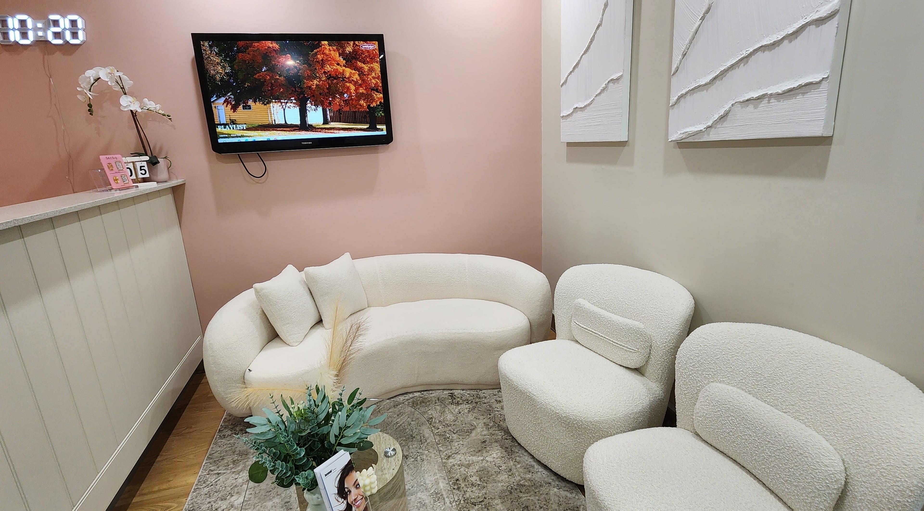 Inviting seating in Glow Body & Mind's North Sydney reception, featuring plush chairs and warm decor.