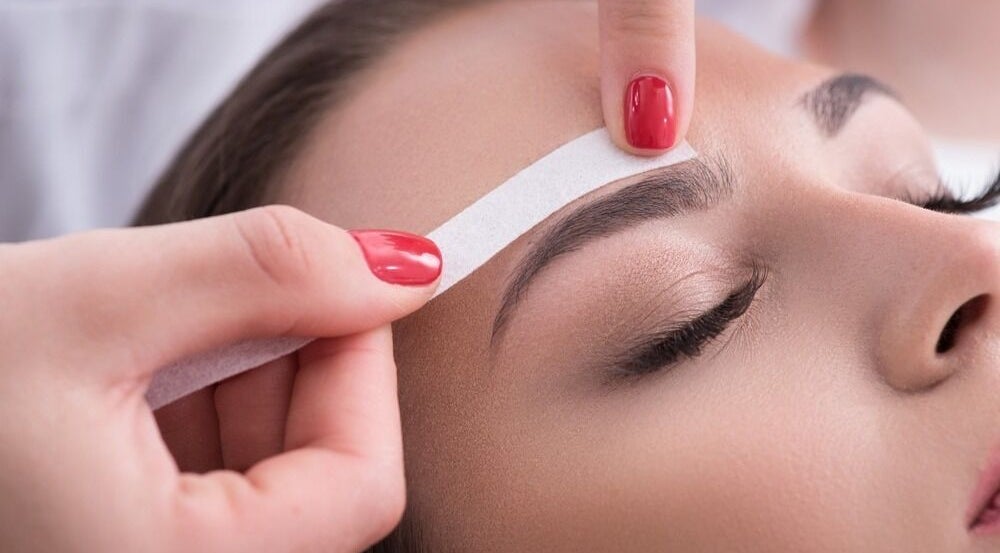 Expert eyebrow shaping at ND Esthetics 246, BB, enhancing beauty with precision.