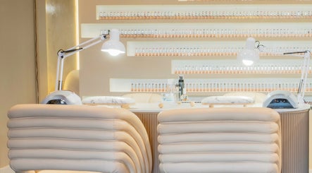 Stylish manicure stations at Mèye in Montréal, Québec, CA with elegant seating and modern lighting.