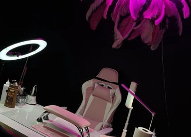 Chic nail salon setup with pink lighting at nailsby_nara, Bridgetown, Saint Michael, BB.