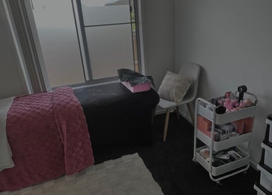Cozy treatment room at Lash’d by Grace, Redbank Plains, Queensland, AU, featuring a comfortable bed and beauty tools.