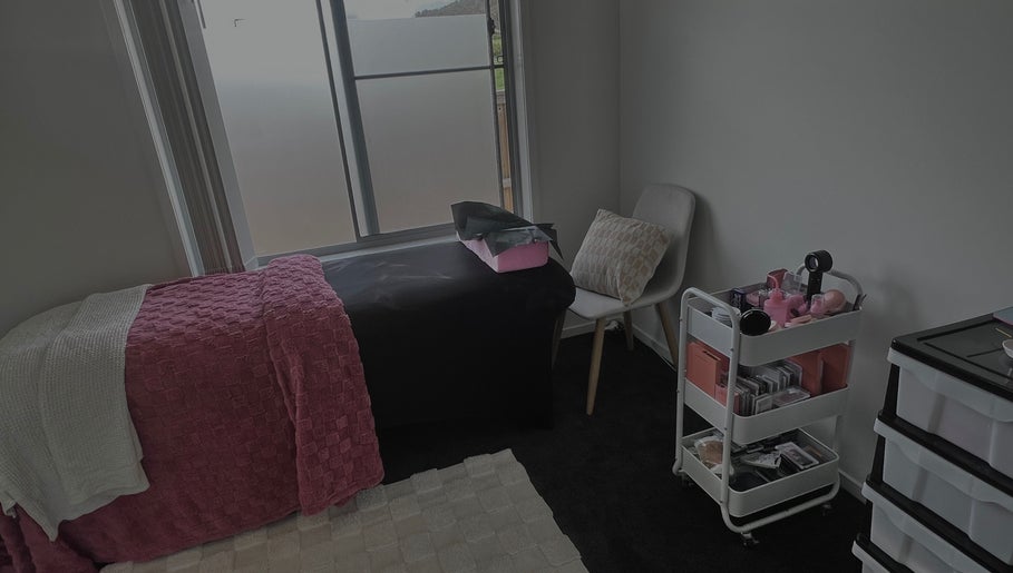 Cozy beauty treatment room at Lash’d by Grace in Redbank Plains, Queensland, AU, featuring a plush bed.