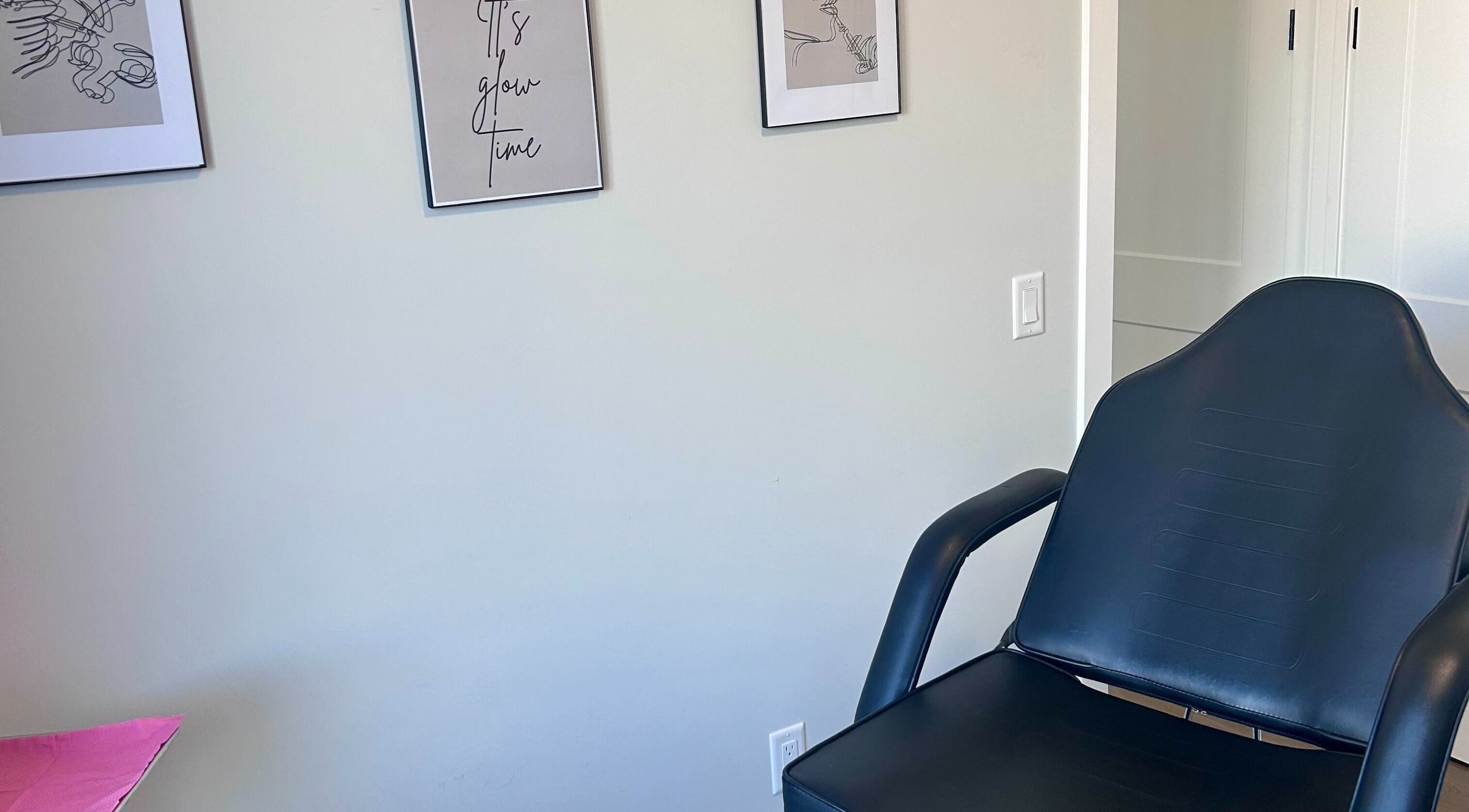 Elegant chair and wall art at Botox Beautiful, Okotoks, Alberta, CA.