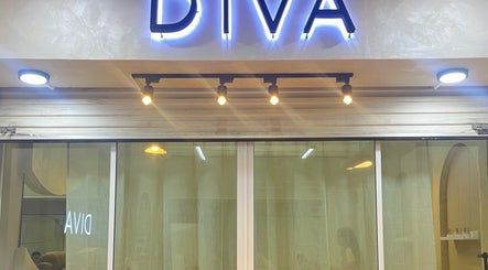 Entrance sign of Diva Nailslash in Krung Thep Maha Nakhon, featuring illuminated lettering.