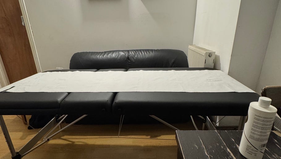Massage table in X-X, a serene venue in London, England, GB, ready for relaxation and therapy.