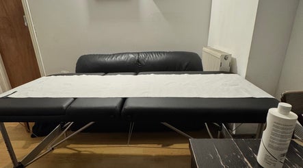 Massage table in X-X, a serene venue in London, England, GB, ready for relaxation and therapy.