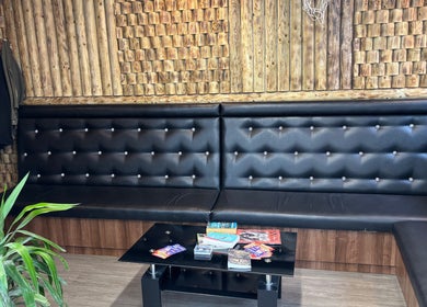 Luxurious lounge area in CutsByTy, Brighton And Hove, England, GB, featuring stylish seating and decor.