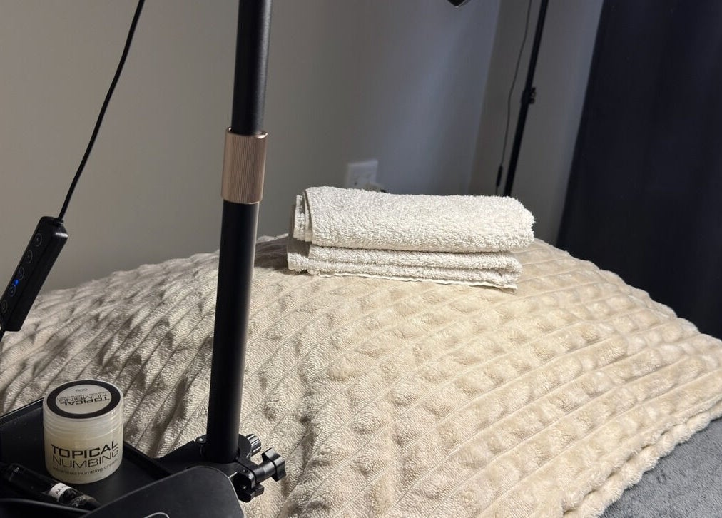 Relaxing therapy setup at Blaauwtiful Brows & Lashes, Pretoria, Gauteng, ZA with soft towels and skincare products.