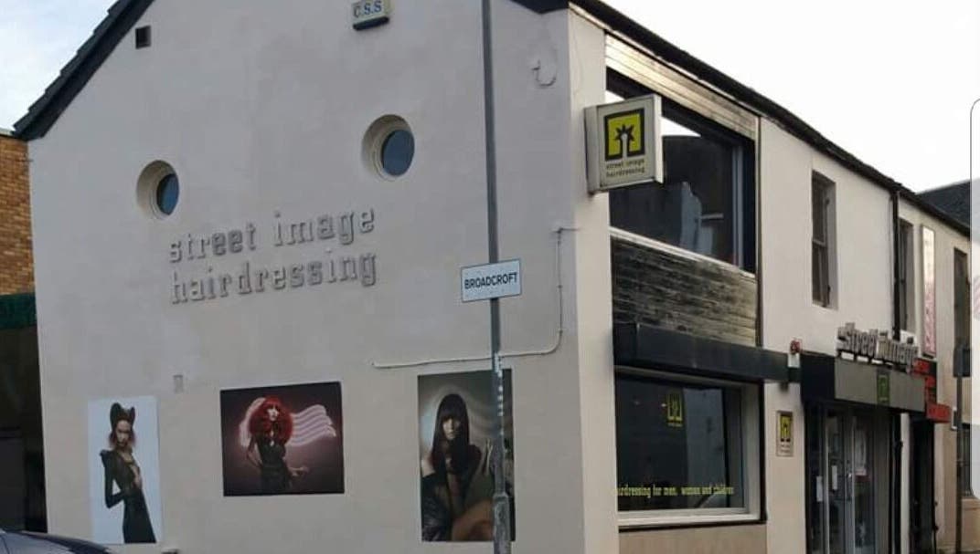 Exterior of By Louise Bamford salon in Kirkintilloch, Scotland, GB, showcasing stylish hairdressing artworks.