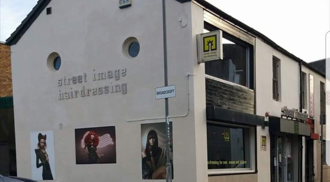 Exterior of By Louise Bamford salon in Kirkintilloch, Scotland, GB, showcasing stylish hairdressing artworks.
