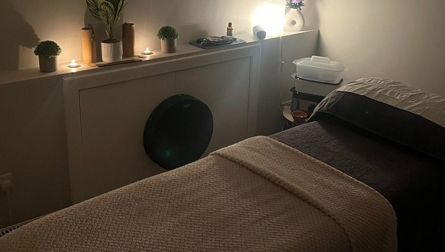 Cozy therapy room at Manifest Hypnotherapy, Kirkintilloch, Scotland, with a soft-lit ambiance and calming decor.