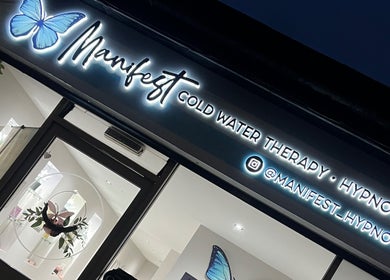 Signage of Manifest Hypnotherapy, Kirkintilloch, Scotland, GB with butterfly logo and welcoming entrance.