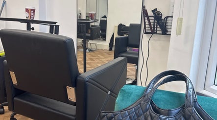 Chic interior of Maria Salon in London, England, GB, featuring a stylish chair and mirror setup.