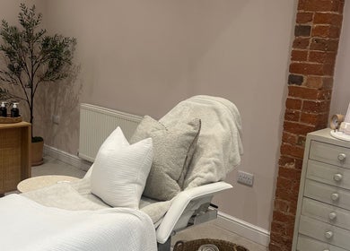 Cozy beautician space at Georgia Bea Manicurist, Nether Broughton, England, GB with plush cushions and decor.