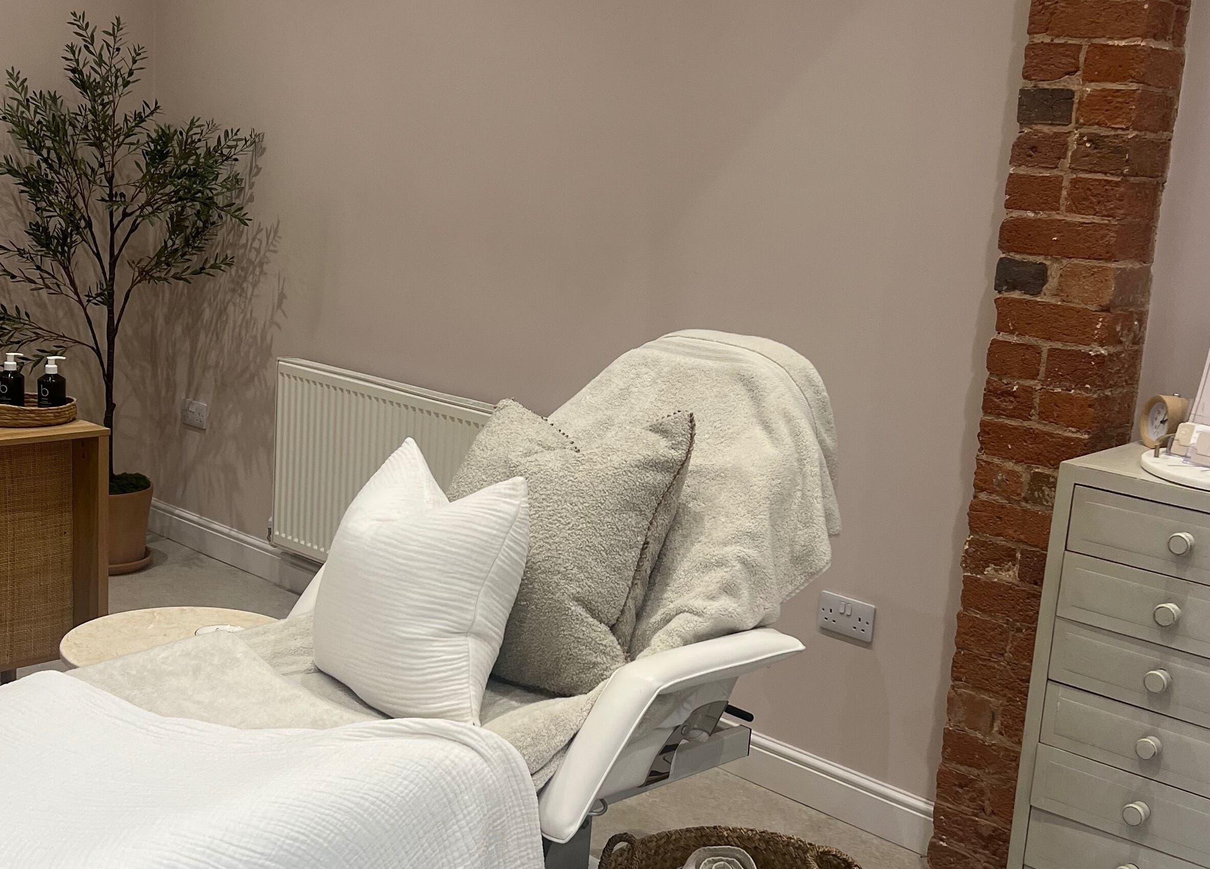 Cozy beautician space at Georgia Bea Manicurist, Nether Broughton, England, GB with plush cushions and decor.