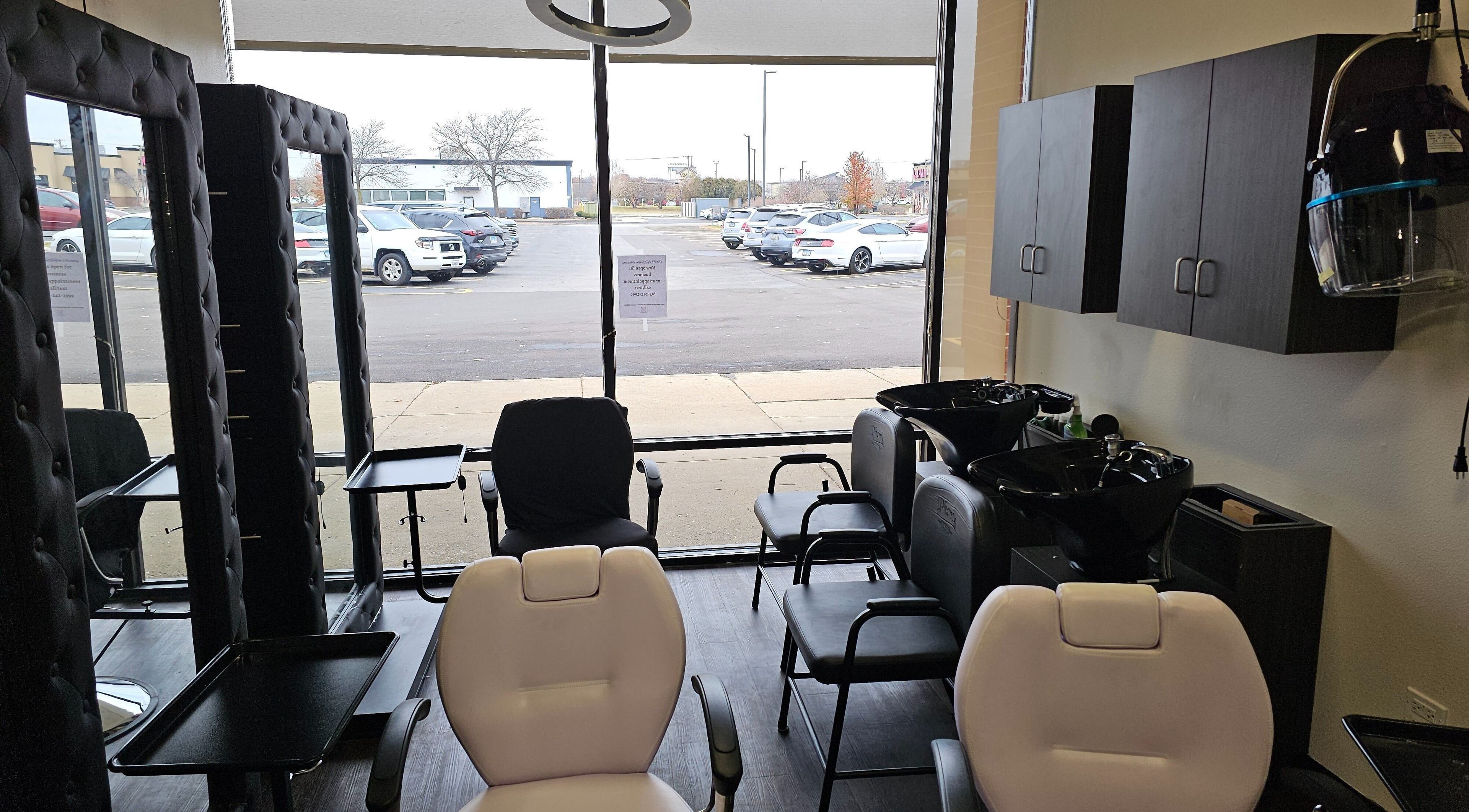 Modern salon interior at MICKnifEcYnt Artistry in Oswego, Illinois, US, showcasing stylish chairs and hair stations.