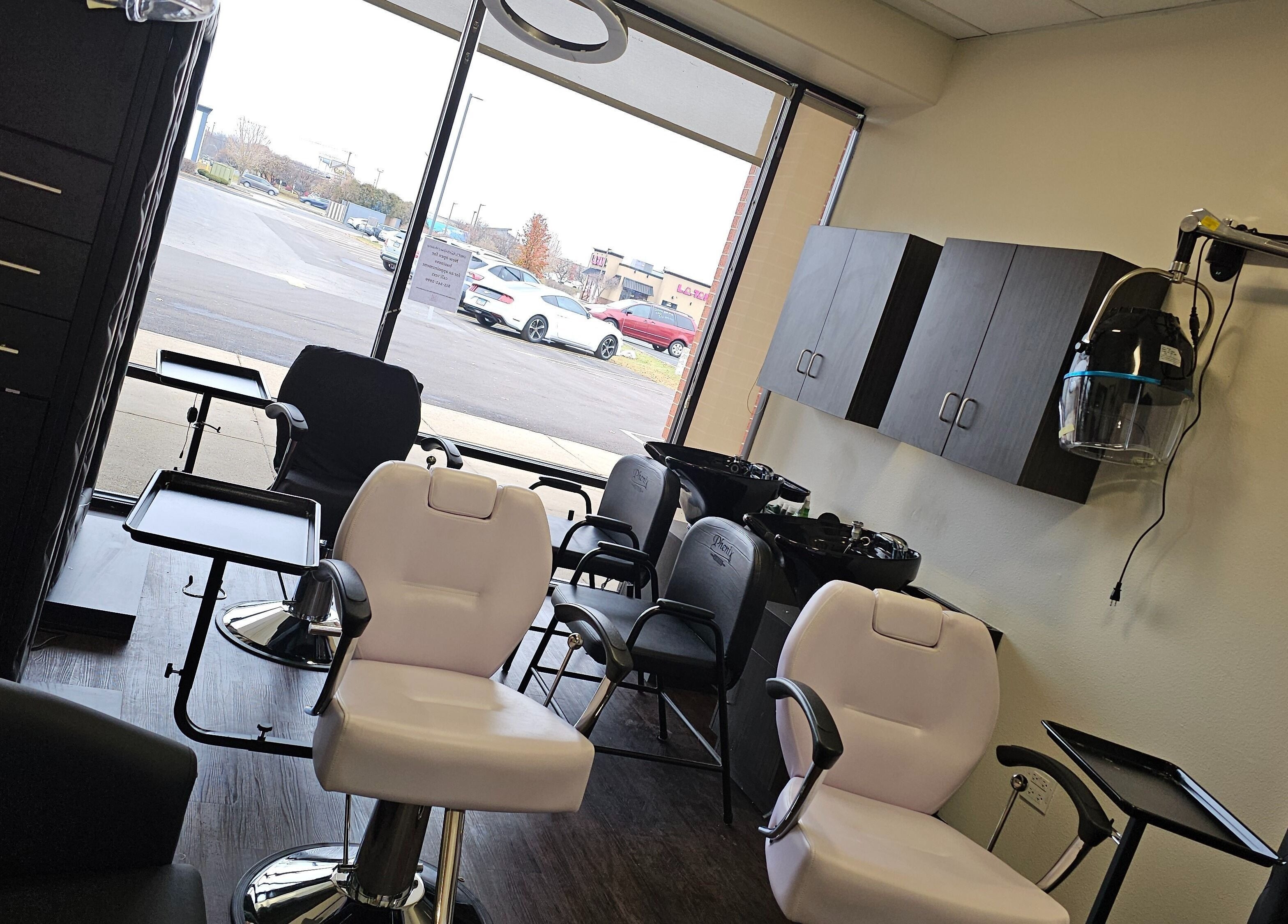 Interior of MICKnifEcYnt Artistry salon in Oswego, Illinois, US with styling chairs and hair stations.