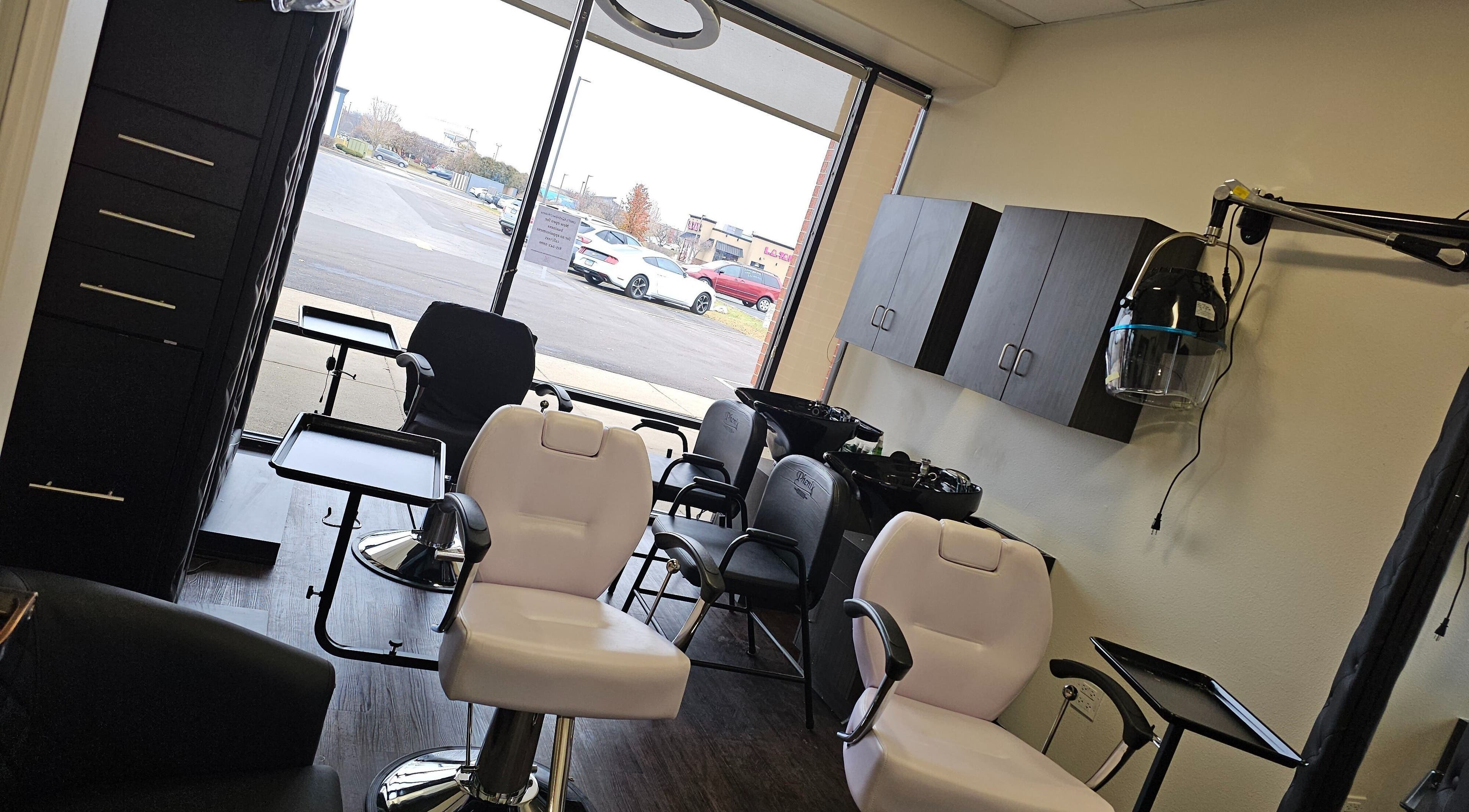 Interior of MICKnifEcYnt Artistry salon in Oswego, Illinois, US with styling chairs and hair stations.