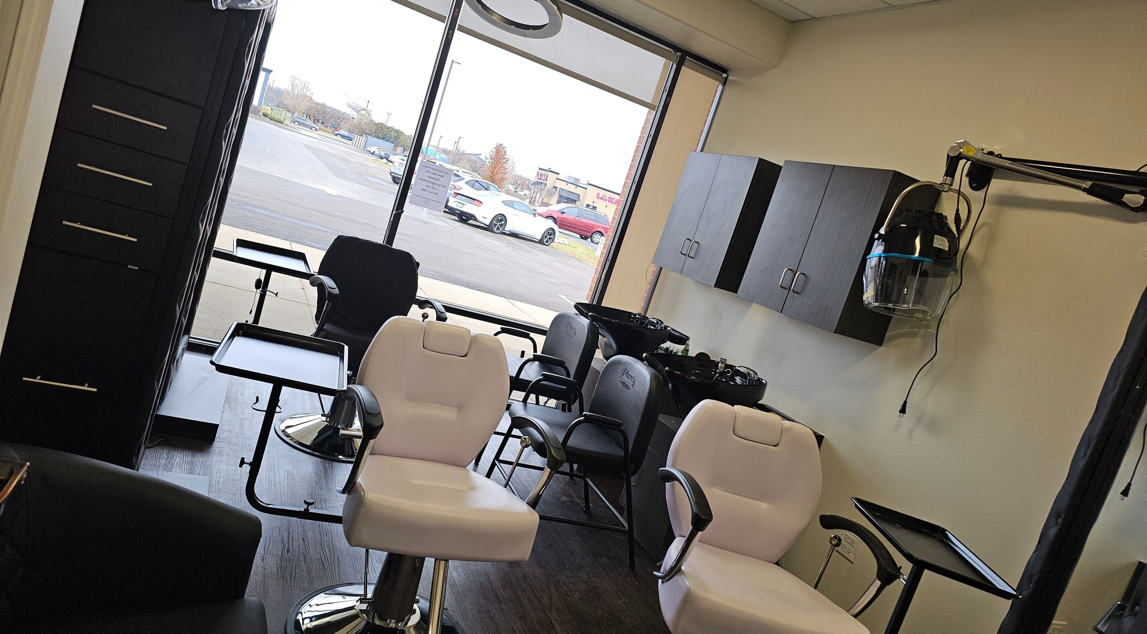 Interior of MICKnifEcYnt Artistry salon in Oswego, Illinois, US with styling chairs and hair stations.
